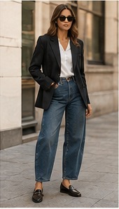 Woman wearing a tailored blazer with wide-leg trousers