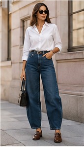 Woman wearing wide-leg trousers with a crisp white button-down shirt